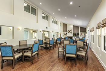 A large room with tables and chairs.